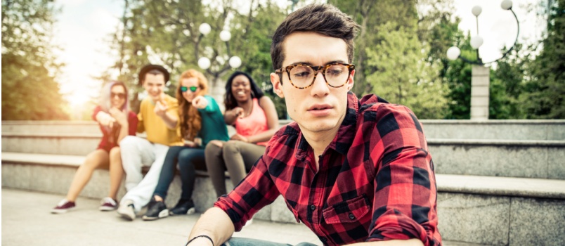 friends mocking sad man