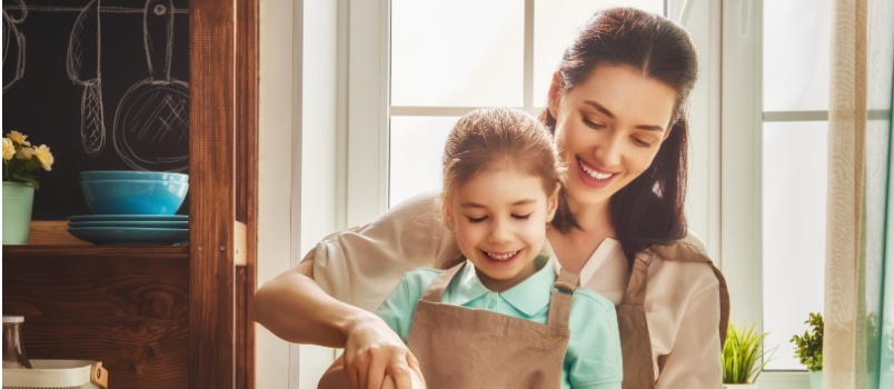 mother daughter cooking together