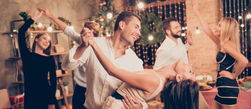 Excited couple dancing together 