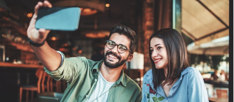 Young couple taking selfie 