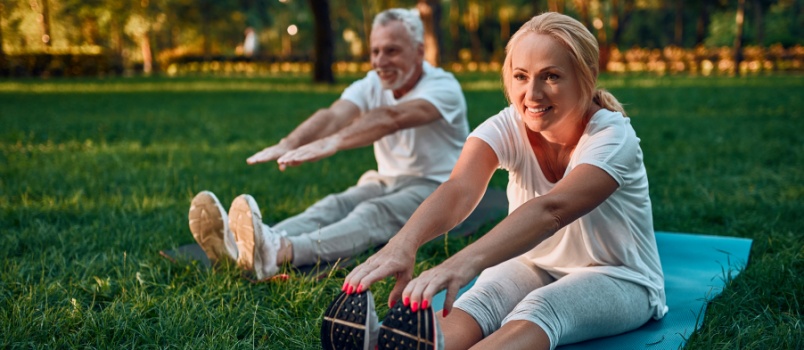 Mature people doing yoga