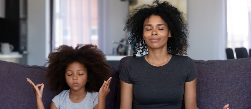 Mother and daughter doig yoga