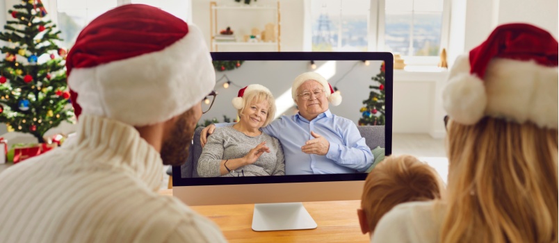 Family having video chat with grandparents