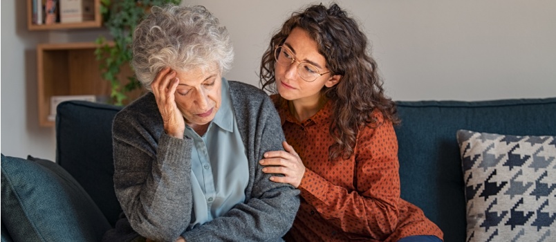 Caring daughter comforting mother 