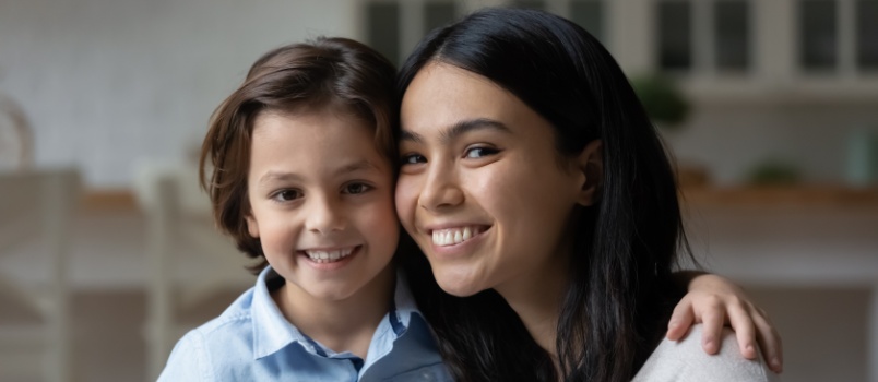 Happy young mom and daughter