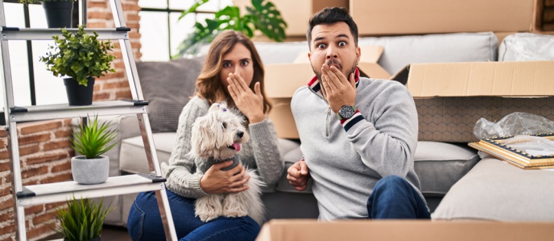 Hispanic couple sitting on floor