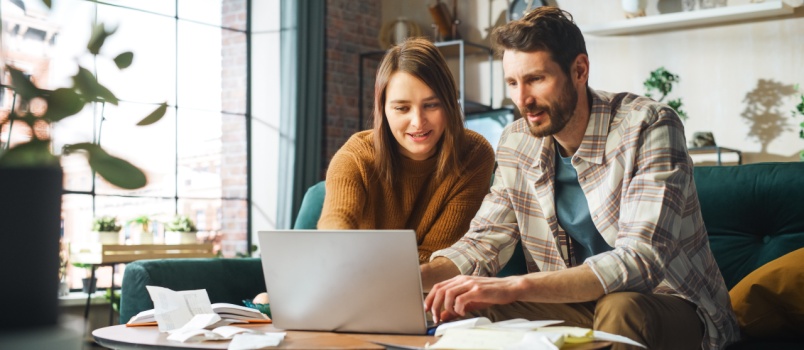 Couple using laptop
