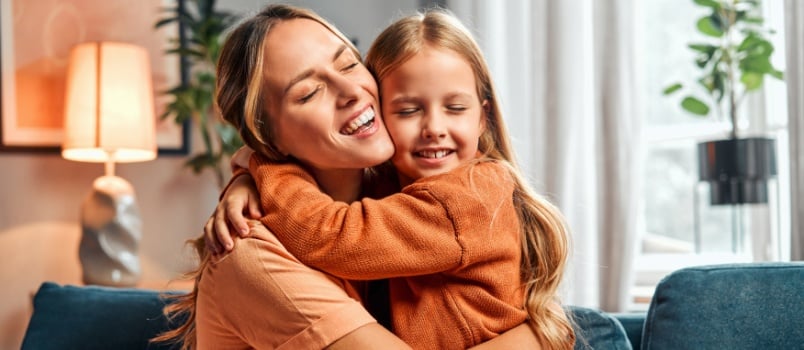 Mother daughter hugging each other