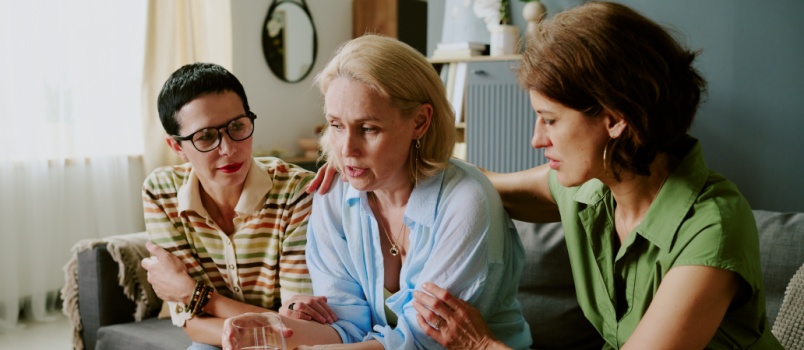 kids comforting sad woman