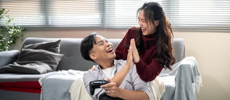 Young couple playing video games