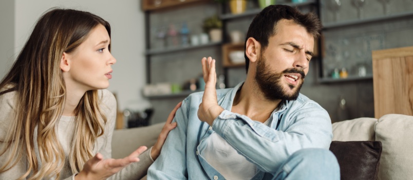 Angry man doesn't paying attengtion to woman