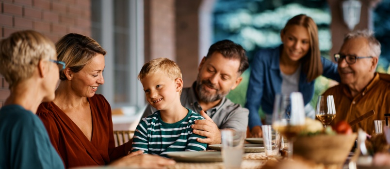 Happy family having meal together