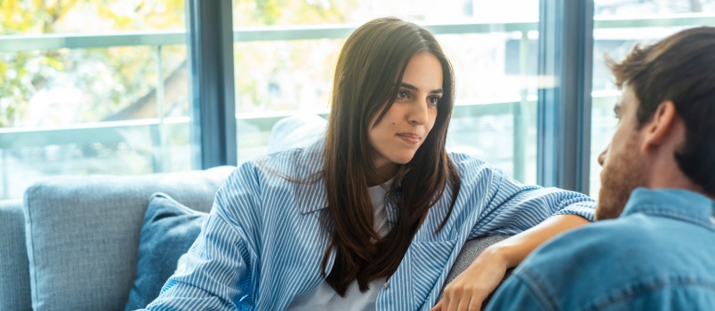 Young couple sitting on couch