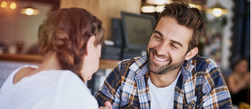 Young loving couple holding hands