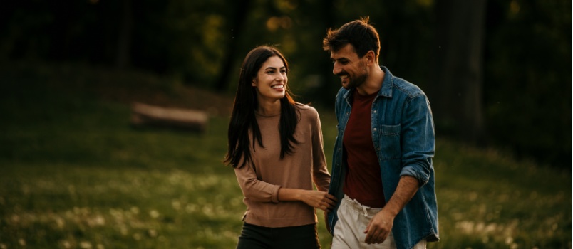 Young couple walking in garden