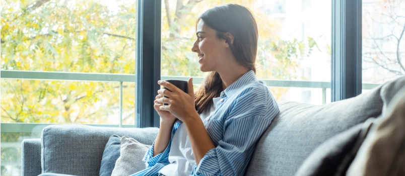 Woman sitting beside window