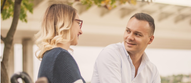 Couple talking outside in park