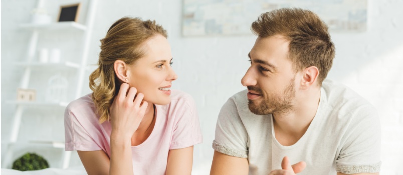 Smilling couple looking at each other
