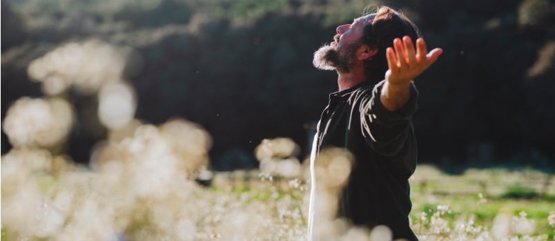 Man opening arm loving nature
