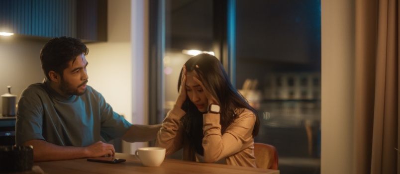 Man comforting sad wife