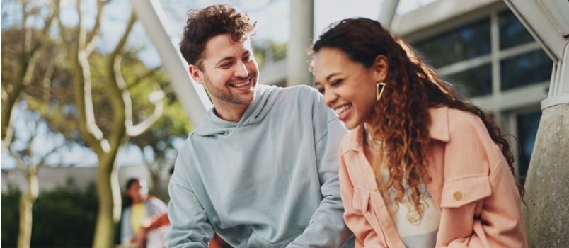 Couple talking to each other and laughing