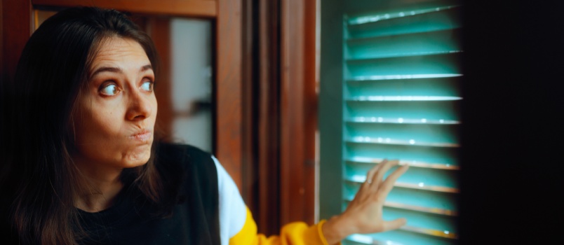 Woman spying on her neighbour