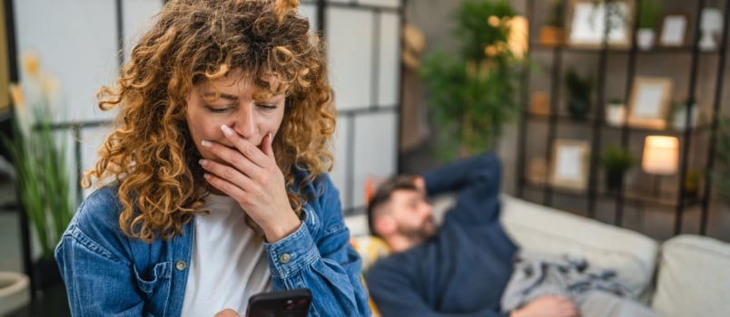 Woman checking husband phone