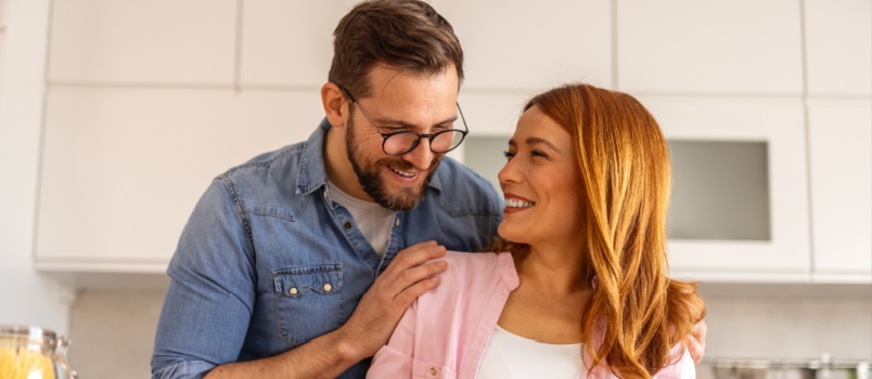 Young couple cooking food together