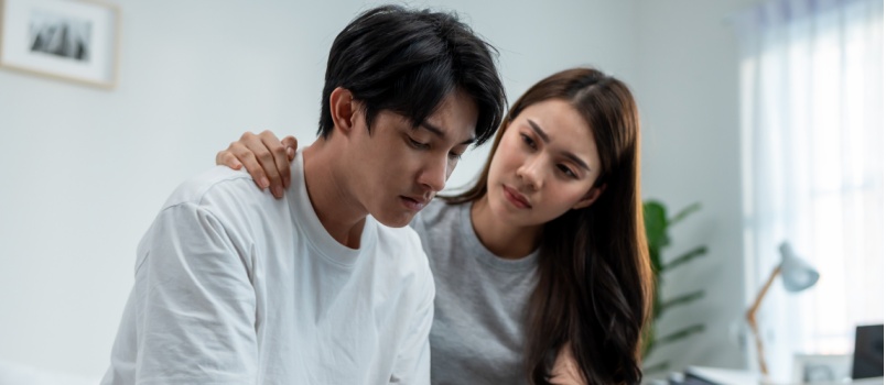 Woman comforting her boyfriend