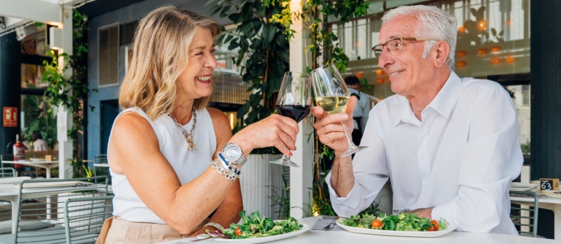 Retired couple toasting wine
