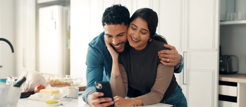 Loving couple using smartphone