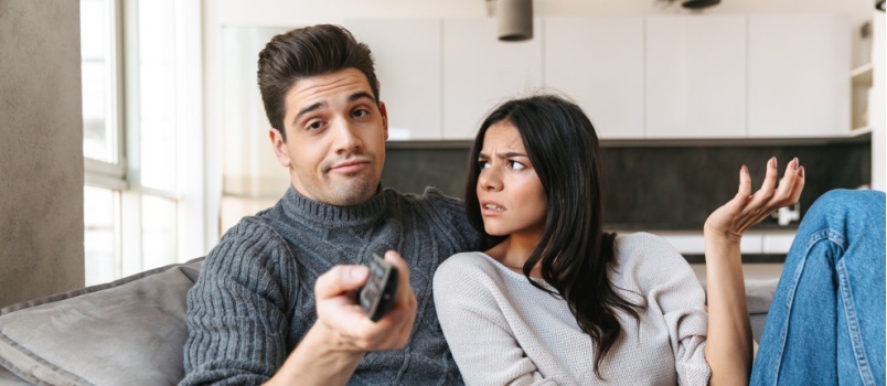 Young couple relaxing at couch