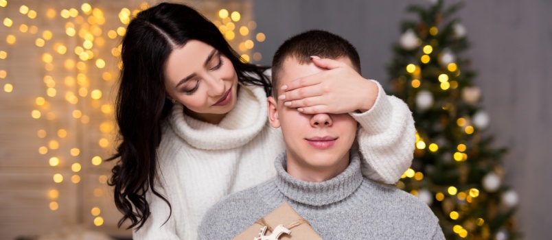Woman surprising woman with gifts