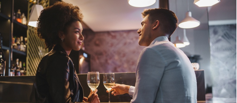 Young couple having drinks together