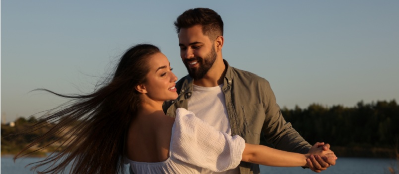 Beautiful couple dancing on beach