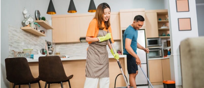 Couple doing hoiusehold work together