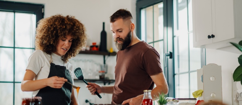couple cooking in kitchen