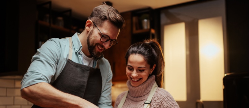 Young couple cooking together 