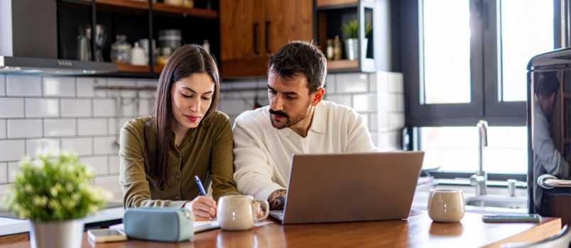 Young couple calculating finance