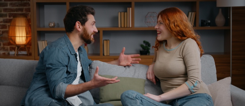 Smilling couple talking to each other