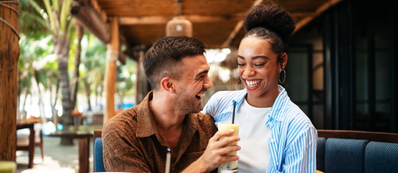 Happy couple enjoying breakfast in cafe 