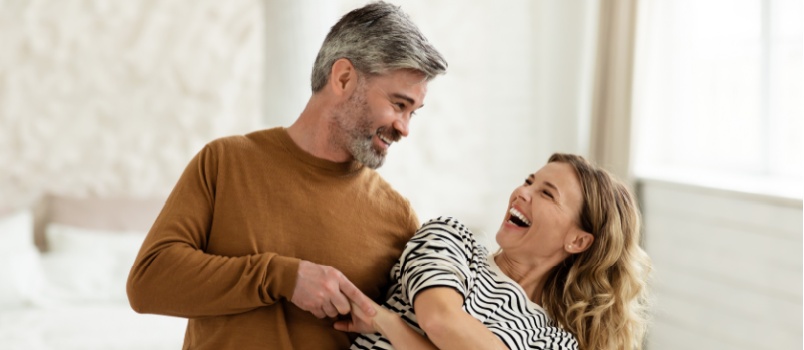 Joyful couple dancing together