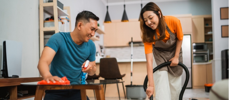 Couple doing household work together 