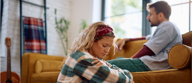 Sad woman sitting on the floor
