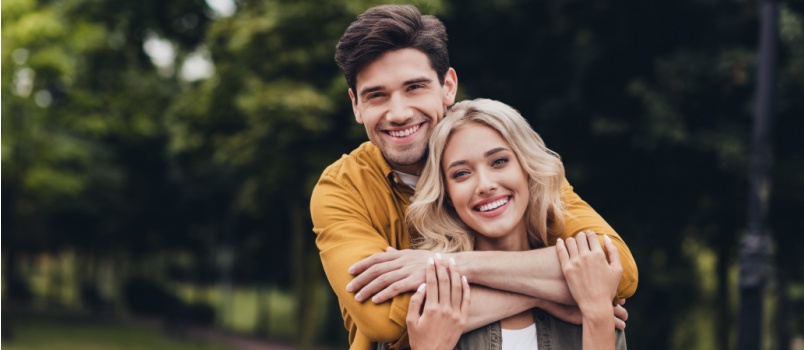 Young loving couple in park 