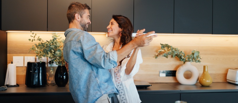 couple dancing in kitchen