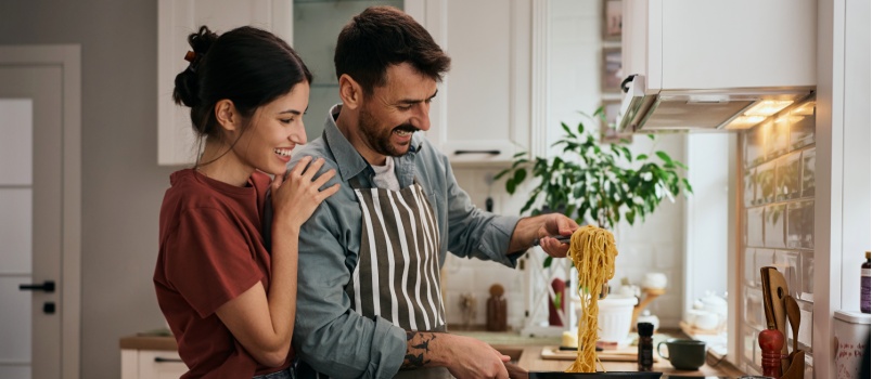 Young couple cooking together 