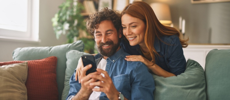 Young couple using phone 