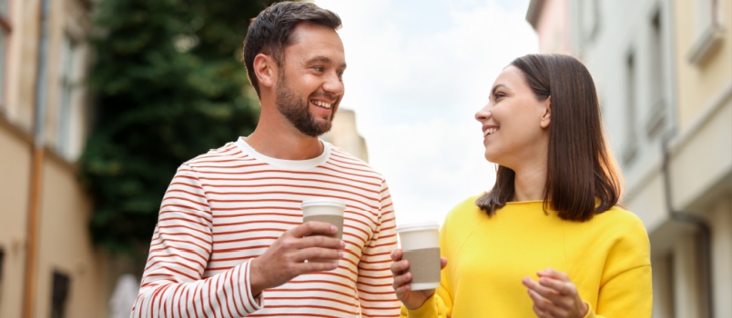 Couple holding drinks in hand