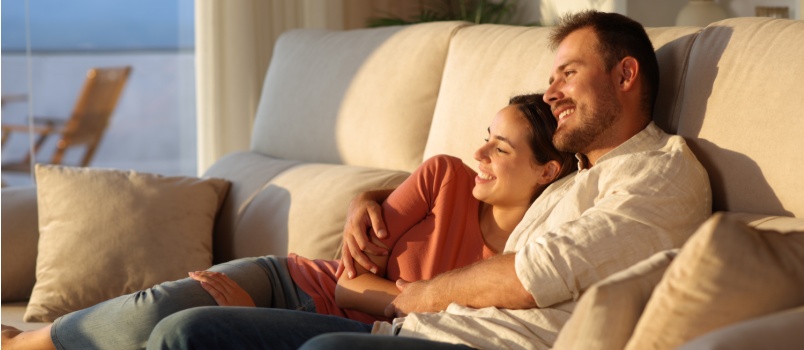Young couple relaxing on couch